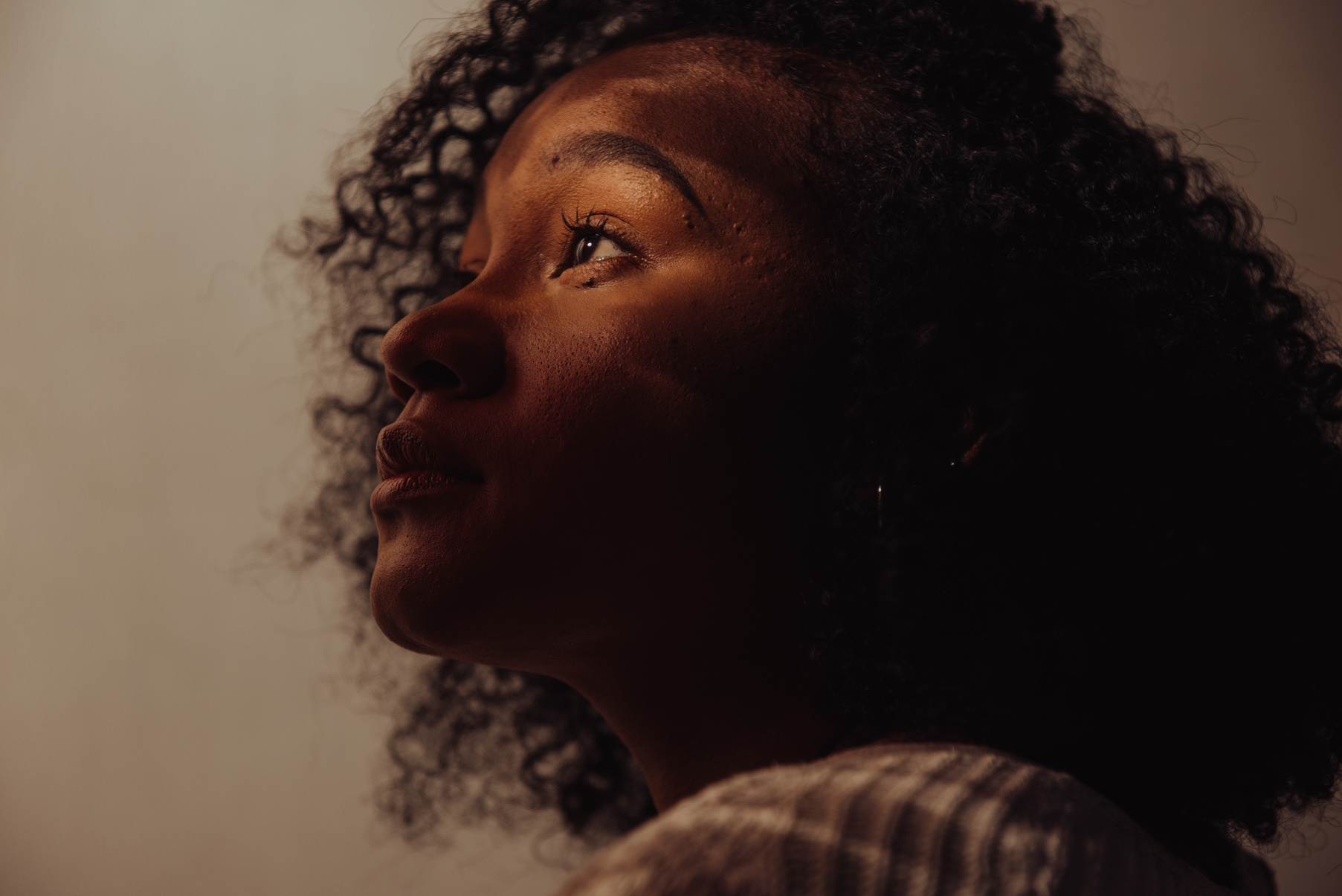 Woman Sitting in Room with Light Coming In